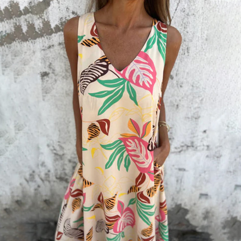 Modna sukienka z dekoltem w serek, luźną kieszenią i nadrukiem bez ramiączek