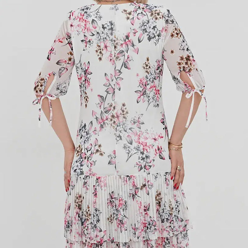 Elegancka damska sukienka plisowana z krótkim rękawem i długą spódnicą